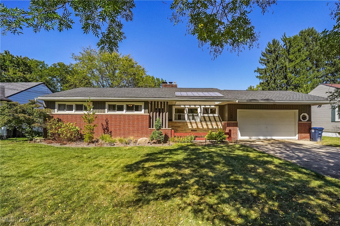 Welcome to 1159 Garman Rd. Located in a charming West Akron neighborhood, this home boasts excellent curb appeal with its well maintained exterior and inviting covered front porch. Step inside to discover the warm atmosphere that only homes built in the 50’s and 60’s can provide. You will enjoy the spacious living areas that provide lots of natural light making every day feel bright and welcoming. The large living room includes hardwood flooring, a woodburning fireplace and is combined with a dining area that provides built in cabinetry for your “special dishes. The eat-in Kitchen has many cabinets and plenty of counter space, and all appliances are included. There are two nice sized bedrooms, and a master bedroom with an updated ensuite bath. The second full bath has also been completely updated. Continuing to the basement you will find a huge rec room with new carpeting, wood-burning fireplace, a bar that includes a wet sink and refrigerator, and a work-out room and office. Waterproofing has been done includes a lifetime transferrable warranty, The roof was replaced in 2020 along with gutters and downspouts. A/C in 2019. The back yard is the spot to be enjoying your Cedar deck and an incredible sunset while soaking in your hot tub. Plenty of room to grow your favorite vegetables is a definite plus. Whether you’re unwinding in the comfortable living room or watching a sporting event in your Recreation room, 1159 Garman is a place you will love to call home. Don’t hesitate, call your favorite agent to arrange a private showing!