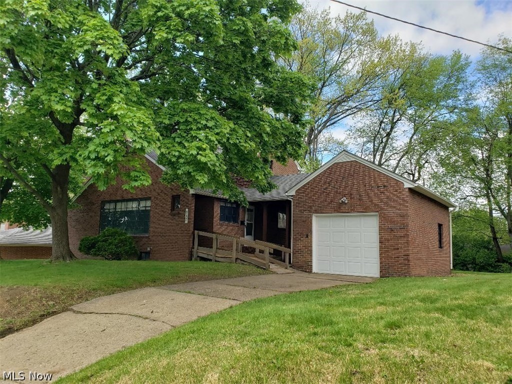 Move-in ready brick home with hardwood floors, an updated kitchen and bath, full basement, and attached garage. Great for an owner-occupant or investor.