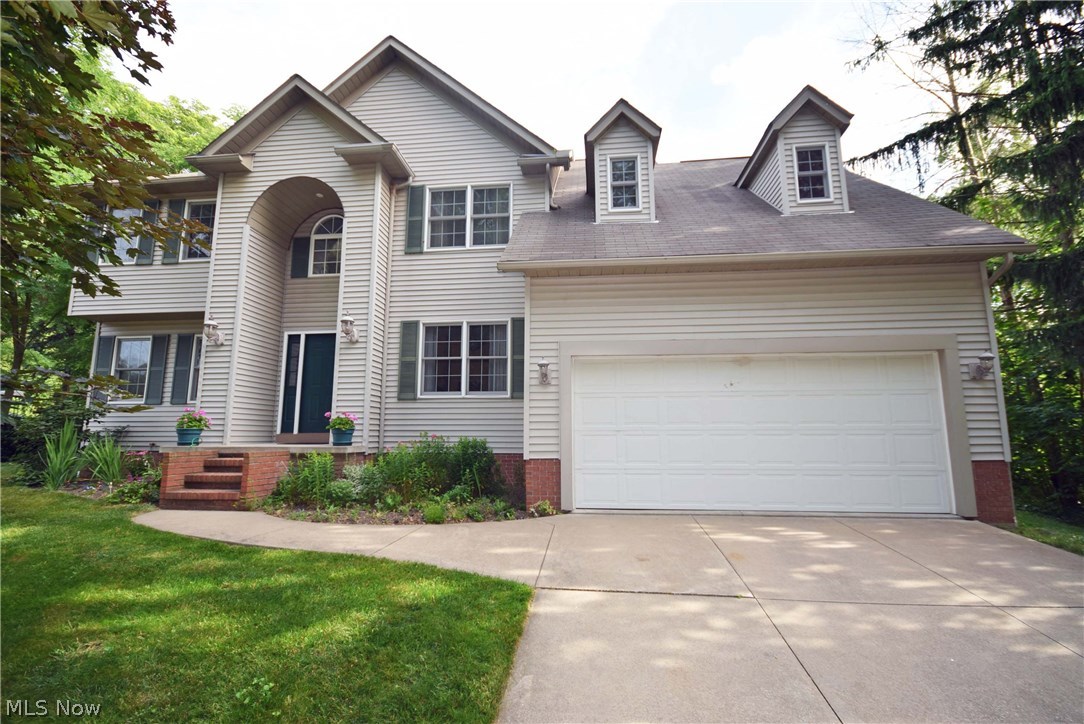Get ready to enjoy summer! This property has it all. Gorgeous in-ground pool, spacious patio and private park-like backyard. Open the front door and you're greeting by a spacious 2-story foyer with oak hardwood floor and turned staircase. Spacious living room with attractive gas fireplace. Bayed dinette and gourmet kitchen w/ island & planning desk.  First floor laundry and half bathroom. Master suite has 2 walk-in closets, shower, and garden tub.  Large 2nd floor hallway leads to bedrooms 2, 3 & 4. Rec. room and activity room finished in the basement with tons of storage space. Great opportunity to live in Green outside of a typical neighborhood with tiny lots! The privacy and outdoor space create the best setting in Green just minutes from everything! Call today to schedule your showing. Don't wait til it's sold!