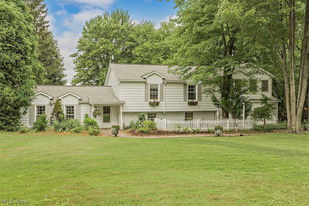 Welcome to the idyllic neighborhood of Pilgrim Village. A serene oasis tucked away for your relaxation but just a short commute to I-422 for your convenience. Complete with a private five acre lake for swimming, boating & fishing, a community pavilion, & playground; there's something for everyone. The beloved house is warm, inviting & full of charm.  An open custom kitchen complete with detailed brick work, an island & peninsula for extra prep space & seating, granite counters & stainless appliances. Bonus room off the kitchen makes a great play area or office, adjacent to the media room complete with built in sound system, double doors & fireplace. The great room at the back of the house is magnificent w/ built in cabinetry & counter space finished with sink & refrigerator, brick fireplace and walls of windows & doors to the beautiful yard- colorful gardens, the spacious deck, fire pit court yard, & amazing private beach access to Lake Taylor. Retreat upstairs to the five bedrooms & t