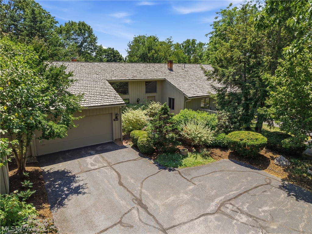 Tucked away at the end of a quiet cul-de-sac in Aurora's prestigious Concord Downs of Walden, this beautifully maintained condominium offers the perfect blend of privacy and maintenance-free living. Surrounded by mature trees and tranquil wooded views, this residence lives like a single-family home while providing the convenience of a low-maintenance lifestyle. Offering over 4,100 square feet of finished living space, the thoughtfully designed floor plan features three bedrooms, three full bathrooms, a versatile loft, and the convenience of true first-floor living with a spacious primary suite and first-floor laundry. Soaring ceilings, expansive windows, and two impressive double-sided fireplaces create warm, inviting spaces filled with natural light.
The main level flows seamlessly from the living areas to the kitchen, complete with a convenient wet bar. Step outside onto the newer Trex deck or unwind on the lower-level patio, both offering privacy and beautiful natural views. The spacious primary suite serves as a private retreat, featuring a relaxing jetted tub and a unique walk-in closet with direct access to an expansive unfinished storage area - rare and desirable feature in condo living. The finished walkout lower level nearly doubles the home's living space and is ideal for hosting family and friends. Complete with a second wet bar, dedicated bedroom/office, expansive recreation areas, a second double-sided fireplace, and direct access to the patio, it offers incredible flexibility for entertaining, working from home, or accommodating overnight guests. Located within the highly sought-after Walden community, residents enjoy beautifully maintained grounds, mature landscaping, and a peaceful park-like setting just minutes from shopping, dining, golf, parks, and major commuter routes. Don't miss out, schedule your showing today!
