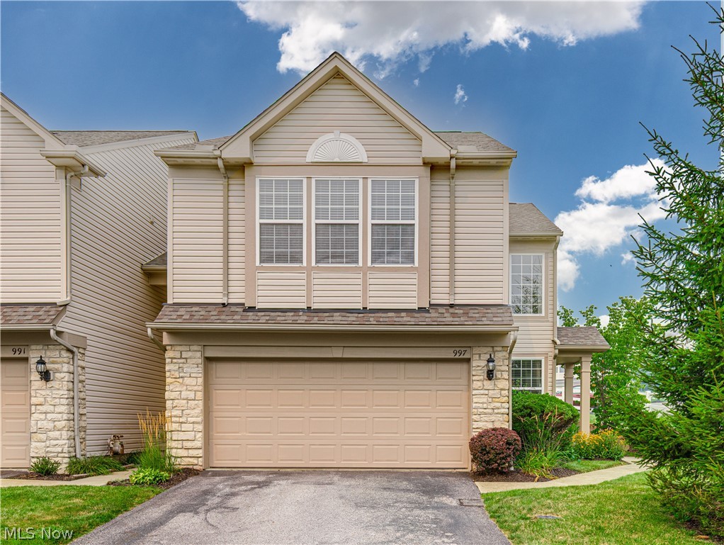 Welcome to this beautiful townhouse-style condo in desirable Copley, OH! Featuring 3 bedrooms, 2.5 bathrooms, and 1,592 square feet of above-grade living space, this home offers a spacious and functional layout. As you step inside, you're welcomed by high vaulted ceilings that create a bright, open feel and lead into the inviting main living area. The spacious living room is filled with natural light and centered around a cozy gas log fireplace, making it the perfect place to relax or entertain. The living room seamlessly flows into the eat-in kitchen, featuring stainless steel appliances, oak cabinetry, and a spacious dining area. Sliding glass doors off the dining area lead to the back patio and yard, providing the perfect space for outdoor enjoyment. A convenient half bath and access to the attached 2-car garage complete the main level. Upstairs, you'll find a cozy loft overlooking the main living area, along with the spacious primary suite. The primary suite features a large walk-in closet and a well-appointed en-suite bathroom. Two additional generously sized bedrooms, a full bathroom, and a conveniently located second-floor laundry/utility room, situated between the primary suite and the secondary bedrooms, complete the upper level. Recent updates include a new furnace (2025) and new central A/C (2024). Ideally located near I-77, Route 21, the Montrose shopping district, restaurants, and everyday conveniences. Don't miss your opportunity to own this move-in-ready condo. Schedule your private showing today!