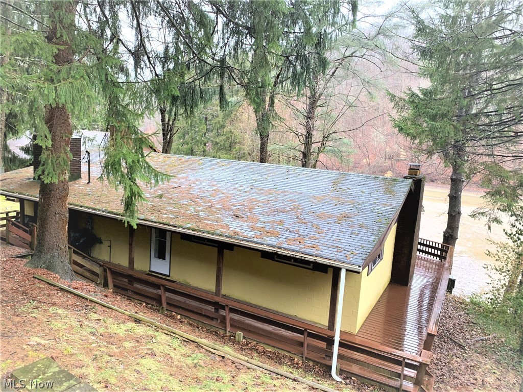 Life is better at the lake!  This 2 bedroom, waterfront, rustic cabin at Austin Lake is ready for a new owner! Enjoy your weekends relaxing on the huge, multi-level deck overlooking the lake, swimming, or boating. A lot of residents stay year round, so the option to have yourself a permanent vacation is here also!
Huge great room has sliding glass door allowing access to the deck and a wood burning fireplace,  allowing you to enjoy the beautiful view even on the coldest of days! This place is truly a must see! Summer is right around the corner, call to schedule your showing today!