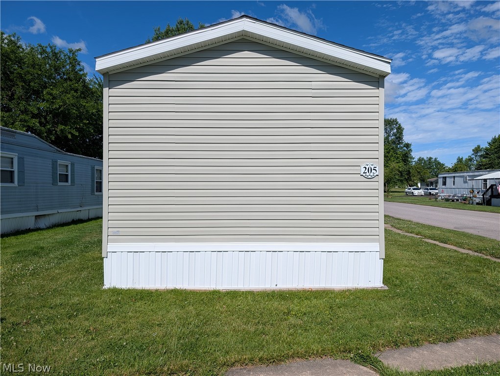 This charming 3-bedroom, 2-bath ranch home featuring an open floor plan and convenient in-suite laundry area. The kitchen comes complete with appliances, making it easy to settle in and start living. Enjoy a vibrant community with monthly activities, plus access to a pool and playground—all with a low lot fee. A handy shed provides extra storage for outdoor items. Ideally located near highways and shopping, this home combines comfort, convenience, and affordability in one perfect package. Just needs some flooring and a little paint