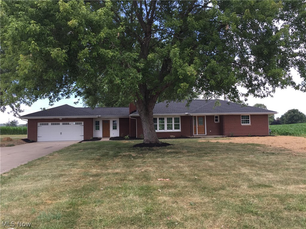 Beautifully remodeled brick ranch on 1 acre with a 28x32 pole building. This home shows just like a brand new home with an open concept design. There are 3 bedrooms, 2 1/2 baths, 1st floor laundry and an attached 2 car garage. There is a full walk-out basement that could easily be finished. This home has a new roof, all new windows and doors, a brand new kitchen, 2 new bathrooms, all new flooring, a new gas furnace with central air, new plumbing throughout and all the way to the septic, new electric, a new cement patio and so much more. It is a great location with easy access to I77 and just minutes to Canton. This home will  allow for immediate possession!