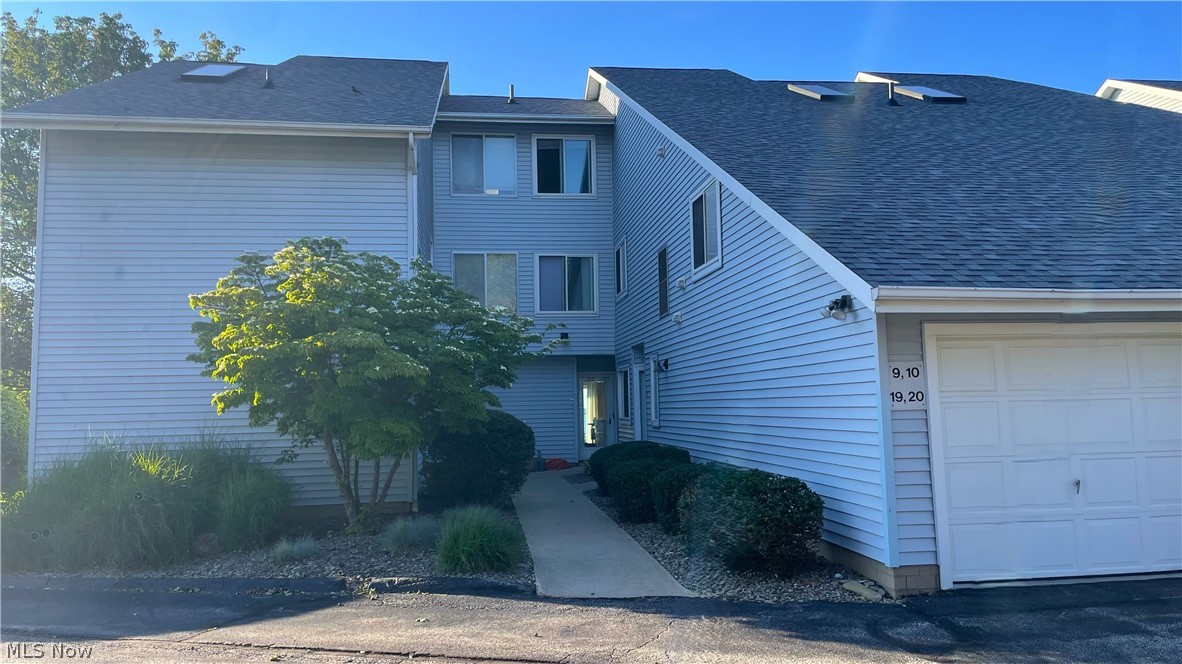 If you've dreamed of living on the lake, this home is for you.  Bright, open living space with walls of windows that frame an idyllic view of Lake Erie and the harbor on every level.  The interior of the townhome has been updated with an all new kitchen, including white cabinetry and modern appliances, quartz countertops, new fixtures and new flooring throughout the first level.  The kitchen, living room with gas fireplace and half bath make up the first floor. A patio off the living room is perfect for relaxing or perhaps growing flowers and herbs. Upstairs is the primary bedroom with access to a private balcony, a full bathroom and second bedroom.  The third level is a loft space that could make a great third bedroom. A refreshed color palette ties the home together.  If the water's edge isn't enough, this is low maintenance living at it's best and even includes a garage to park.  Near retail, restaurants, and the harbor.