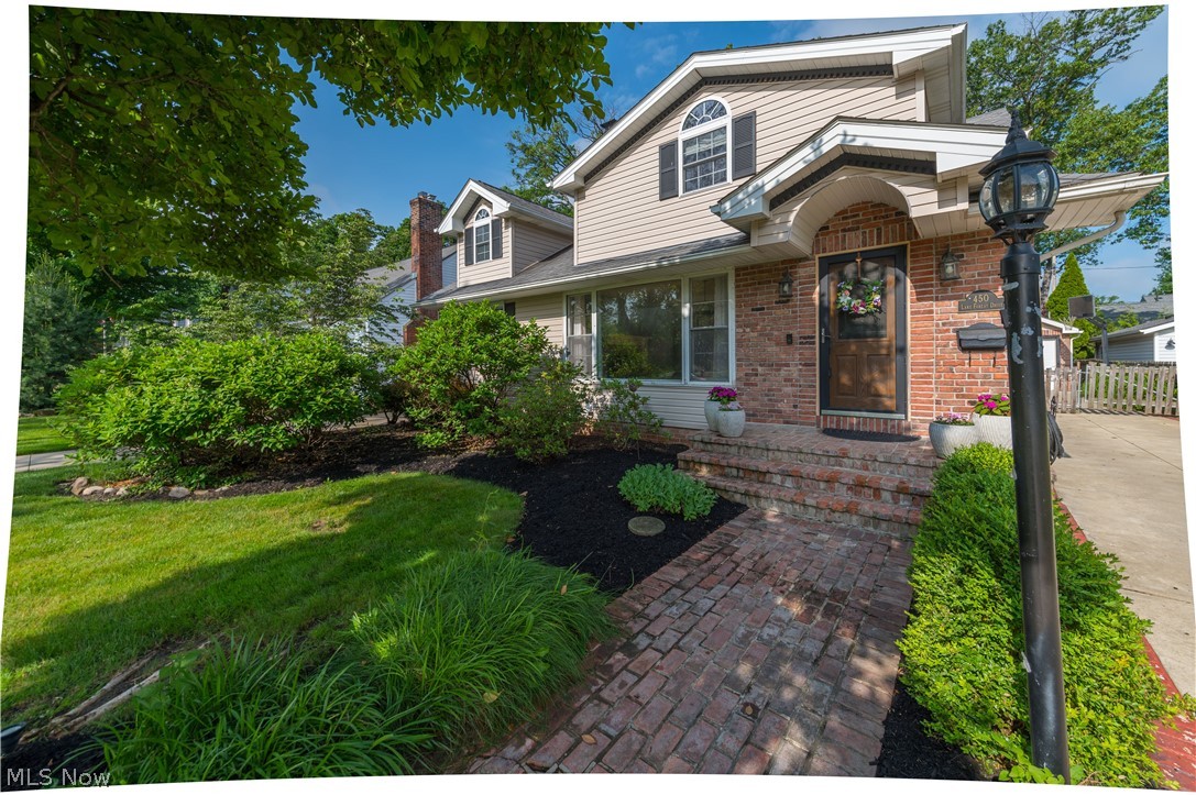 Love where you live! 

Nestled on a picturesque street in Bay Village, this beautiful home offers plenty of space, character, and an exceptional location. Set back from the road and surrounded by mature landscaping, you'll enjoy a peaceful setting just moments from Lake Erie, schools, parks, and all that Bay Village has to offer.

Offering approximately 2,400 square feet plus 700 square feet of finished lower-level living space, this 4-bedroom, 3-full-bath home is designed for comfortable living! The spacious living room serves as a welcoming centerpiece, featuring beautiful hardwood floors, a large picture window, and a cozy wood-burning fireplace. The beautiful wood flooring flows seamlessly across the main level and guides you into two nicely sized first-floor bedrooms, each boasting ample closet space.

The kitchen offers an island, lots of counter space and storage, an eat-in area, plus built-ins for dishes and barware. The adjacent family room showcases wood beams, a second wood-burning fireplace, and sliding doors to the patio.

Upstairs, the impressive primary suite is a true retreat featuring a beautifully updated en-suite bath,  a walk-in shower, and an exceptional walk-in closet with custom storage and organization systems. Directly adjacent within the primary wing is a versatile fourth bedroom—creating the ultimate layout for a private nursery or a quiet executive home office.

The partially finished lower level includes a recreation area, full bath, wet bar, and a spacious laundry room with abundant cabinetry and counter space.

Step outside and enjoy a private backyard retreat with a brick patio, outdoor wood-burning fireplace, mature landscaping, raised garden box, detached two-car garage with an attached storage shed.

Enjoy living just moments from Lake Erie, top-rated schools, beautiful parks, local dining, shopping, and proximity to highways. Don't miss out on the opportunity to live on one of Bay Village's most desirable locations.