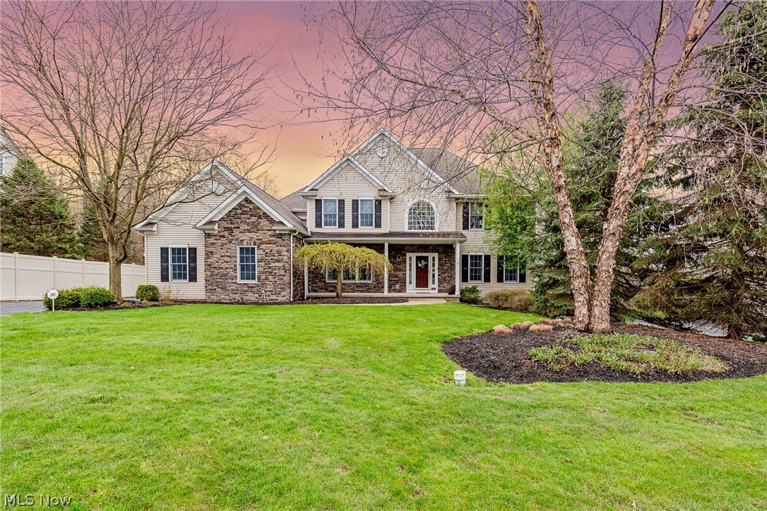 Fall in love with this stunning colonial situated on a serene half acre lot in Chagrin Falls! This gorgeous home features an eat-in kitchen, a step-down family room, and five spacious bedrooms. All that it needs is you! As you step inside the two-story foyer, you will find the formal dining room to your left and the living room to your right. The step-down family room features a cozy fireplace and is open to the eat-in kitchen, which includes granite counters, a full complement of appliances, and a sunny eat-in area. An office, a convenient laundry room, a lovely sunroom, and two half baths complete the first floor. Upstairs, you are sure to love the master bedroom, which boasts a walk-in closet and an en suite bath with double vanities, a step-in shower, and a soaking tub. Four additional bedrooms, two joined by a jack-and-jill bath, and another full bath round off the second floor. The finished lower level is built for entertaining, featuring a family/media room, a bar, a recreation