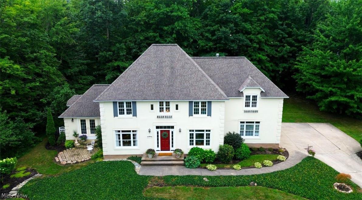 Beautifully appointed & meticulously cared for 3-5bdm, 2.5bath, 3car garage custom-built French Provincial on 1.22acres in a prestigious location of Concord Twp. Donning its distinguished appearance, this home makes a statement of unique & exquisite architecture from the turn into the driveway to the resplendent interior. Quality craftsmanship throughout in the ways of rich Maple hardwd flrs, timeless fluted pilasters, traditional wainscoting, detailed crown molding, arched & transom windows, marble & porcelain, & built-in French County woodwork. Layout & aura of the home is deeply inviting yet practical & lends itself to everyday living & entertaining family, friends, & executives. Welcome in to the 2-story, 17ft foyer steeped w/ beauty, natural light & impeccable woodwork. Just off to the right is the sitting rm w/ French doors & classic built ins. Could be converted to a bdrm or used as an office, library, or LR. To the left of the foyer is the elegant & spacious DR w/, hardwd flrs, ceiling medallion & chandelier. Great rm at 23x17 is open & airy w/ vaulted ceiling, overszd arched windows, & marble accented gas fireplace. Conveniently located off the dining rm & great rm through swinging butler door is the heart of this home ~ the radiant kitchen that looks right out of a magazine. Decorative woodwork, white cabinetry, Corian countertops, 15ft vaulted ceilings & plenty of space for all you want a kitchen to behold is here. Half bath & 1st flr laundry round out the main level. On the 2nd story resides 3 commodious bdrms. Primary suite features its own 14x11 foyer, a transitional flex rm for sitting, dressing, nursery/4th bdrm or office. Huge en suite bath w/ jetted soak tub, low step in shower, & dual vanities. Jack & Jill full bath w/ dual vanities for bdrms 2 & 3. Full bsmnt w/ shelving. Exterior of the home provides luscious greenery, trees for privacy, two patios - one covered - deck & massive 24'3"x12' shed. All major high-cost components of the home newer!