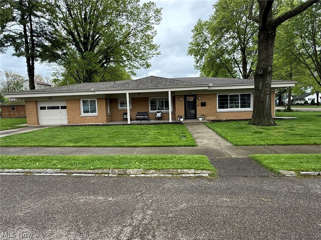 Beautifully remodeled brick ranch.  Charming covered front porch invites you into this fantastic home.  Open floor plan with neutral decor, new drywall and wood laminate flooring.  Brick fireplace in the living room.  New white kitchen with Quartz counters and stainless steel appliances.  Remodeled full bath features quartz counters and double sinks.  Main floor laundry room.  New gas furnace with central air and new Provia windows in 2024+/-.  New asphalt roof in 2023+/-.  Attached garage with hot and cold water access and 16 X12 storage shed.  Large corner lot with 16 X 12 private rear patio.  A must see, move in ready home on the corner of Oak Street and Bowers Avenue.