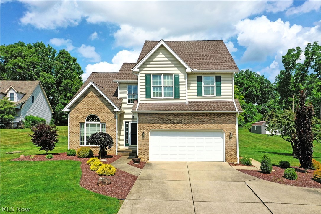 Poland home with 3 bedrooms, two-full and one-half bath on almost an acre! Find comfortable surroundings and an impressively spacious and unique layout, all located within this exciting Poland home! This first-time listing is sure to heat up your summer with its oversized yard, expansive rear deck and two floors of carpeted living space that’s certain to please. Sat in a quiet development on an elevated lot, the engaging residence presents handsome brick work and manicured mulch bed lined with blooming landscaping. The cement driveway leads up towards the two-car attached garage with its tall ceilings. Step inside the home as a towering, two-story foyer wows with its elegant hanging lighting. Tiled flooring gives way to the sunken family room and adjoining formal dining area set just outside the kitchen. A branching hall stretches past both garage access and a half bath to find first floor laundry services. The kitchen itself delights with continued tiled flooring and a match backsplash that runs between the warm, wood cabinetry and charming corner sink with a twin, arch topped window. Sliding doors open to the deck as they illuminate casual dining with potential bar top seating. The living room finds towering ceilings and a matching brick mantle that extends past the tall, lattice windows. Upstairs, an oversized owner's suite includes a walk-in closet and full private bath with soaking tub and hidden commode. The trio of additional bedrooms join a second full bath located mid hall. Plenty of storage is available in the full basement below. The basement could be nicely finished with its open and clean space.