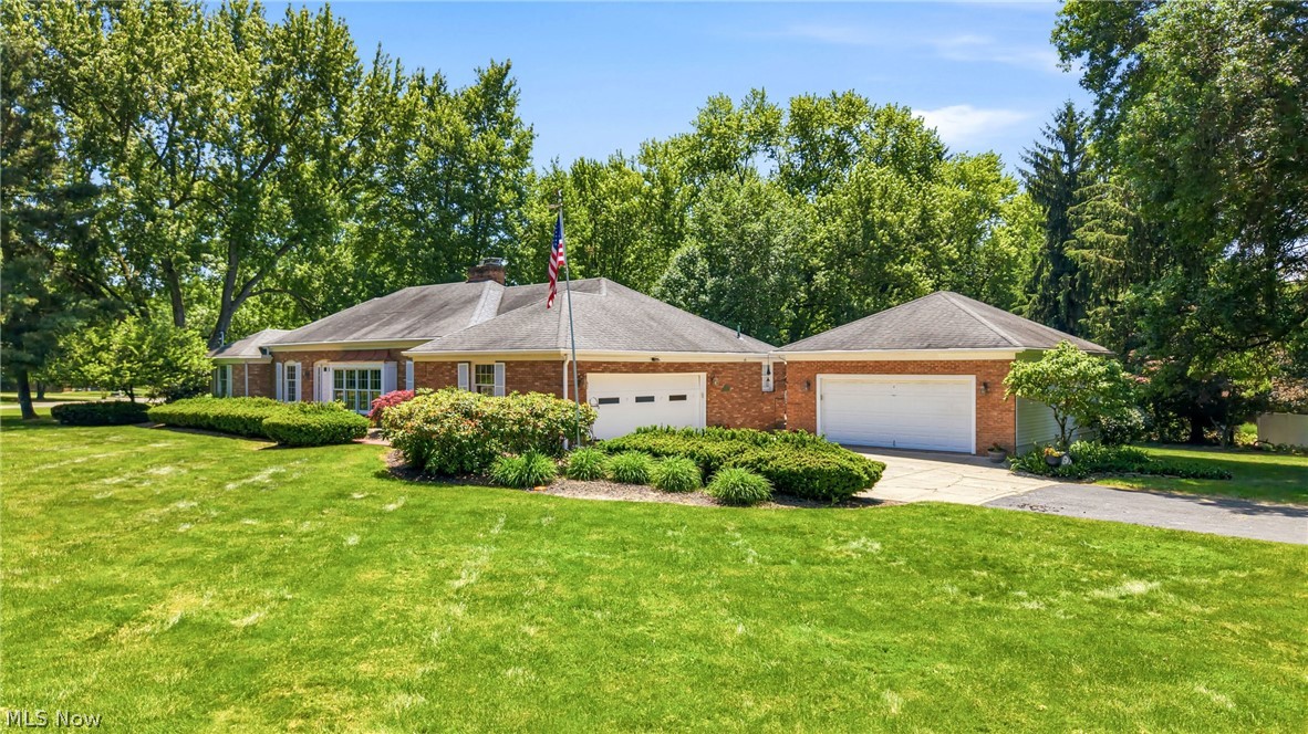 Don’t miss your chance to own this fantastic Liberty brick ranch home on just over an acre corner lot.  The ceramic tiled foyer welcomes family and friends.  The sunken living room is great for formal gatherings.  The dining room is complete with granite topped serving area.  Crown molding  enhances the formal living room and dining room.  An extra large great room complete with fireplace, built-ins, abundant natural lighting and vaulted ceiling is great for entertaining.  French doors open up to the deck, patio and pergola in your parklike private backyard.  The kitchen is complete with all the appliances, granite tiled countertop, pantry and it is adjacent to the hallway of doors featuring a half bath, pantry, closet, basement entrance, and attached garage.  Master bedroom amenities include natural light, his and her walk in closets, dressing space, newer bathroom, laundry and sauna!  You may exit to the backyard also!  Two additional bedrooms and updated full bathroom on the first floor.  You’ll find the fourth bedroom in the basement with full bathroom, room adjacent to the bedroom, two crawl spaces and plenty of storage space.   Two car attached garage and oversized 24 X 28 detached garage.  A walk up attic from the kitchen is partially floored and it has a solar attic ventilation fan.  You’ll never be in dark with the whole house generator.  Furnace and air conditioning – 2025.  Leaf filter gutters with transferrable warranty.  Make your appointment today!