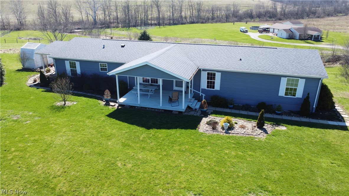 Enjoy the perfect balance of country living and everyday convenience with this 5-bedroom, 3 FULL Bathroom home situated on 3.7 acres in Wheeling Township. Inside, you'll find a spacious 22' x 25' living room, offering plenty of room to gather, relax, or entertain. Outside, the property connects to a peaceful creek while not being located in a flood zone, providing a beautiful natural setting to enjoy. The property also features three outbuildings, including an 18' x 12' building with electricity, offering excellent space for a workshop, storage, or hobbies. Mature apple, peach, and walnut trees add to the charm and character of the property. For added peace of mind, the roof shingles and siding carry a lifetime warranty. Conveniently located just minutes from St. Clairsville, you'll enjoy the privacy of a rural setting with easy access to shopping, dining, schools, and major highways. Schedule your private showing and see everything this unique property has to offer!