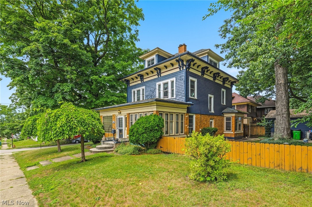 Full of character and offering more than 2,500 square feet, this spacious 4-bedroom, 2-bath home provides the room a growing household needs at an approachable price. Built in 1895 and located near Massillon’s historic Fourth Street neighborhood, the home sits close to downtown, shopping, dining, parks, and everyday conveniences. The main level features a welcoming vestibule, a bright three-seasons room that could also make an ideal home office, a comfortable living room with an inactive fireplace, a formal dining room with a second inactive fireplace, a full bath, and an eat-in kitchen with generous cabinet space. Upstairs, you will find three bedrooms, another full bath, and conveniently located laundry. The finished walk-up attic adds even more flexibility and can serve as a fourth bedroom, playroom, media room, or secondary living space. Outside, the partially fenced side yard includes a shaded patio for relaxing, dining, or play. A spacious two-car detached garage provides additional storage, while the clean basement offers even more room for seasonal items and household needs. With abundant space, classic details, and a convenient location, this home offers the flexibility to grow, gather, work, and live comfortably.