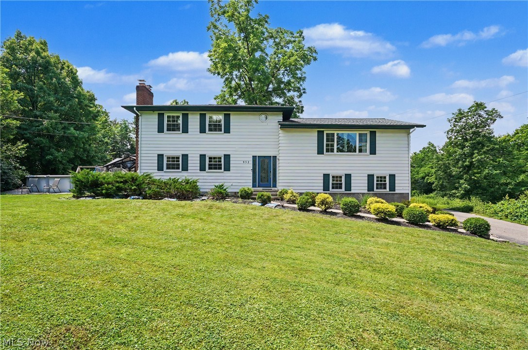Beautifully updated and move-in ready, this light-filled home offers an open floor plan, brand-new luxury vinyl plank flooring, spacious living areas, and thoughtful updates throughout. The oversized 2½-car garage provides abundant storage and access to a private basement entrance. The finished, soundproofed lower level is incredibly versatile, featuring a full bath with an upflush system—ideal for a home office, recreation room, guest suite, workout space, or additional living area.

Situated on approximately 2.5 picturesque acres, the outdoor setting is truly exceptional. Enjoy your own private retreat complete with a pool, beautifully landscaped rock gardens, and scenic trails winding throughout the property. The charming red barn offers the perfect space to gather with family and friends, watch the big game, create a hobby space, or simply relax and unwind.

Experience the peace and privacy of country living while being just 10 minutes from Kent, Hudson, Stow, and Streetsboro. Nearby parks offer opportunities for hiking, kayaking, and enjoying breathtaking sunsets. This unique property combines modern updates, versatile living space, and an incredible outdoor setting—all in a convenient location.