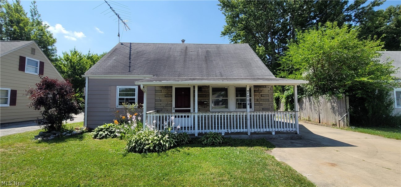 Great opportunity! Three bedroom, one full bath with a nice garage and a huge shed! Tiled kitchen and bathroom. Great looking paved driveway!!!!