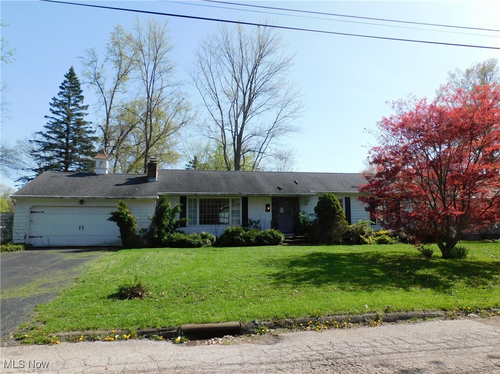 Welcome to this spacious and thoughtfully designed 1,830 sq ft ranch-style home nestled in a serene Saybrook neighborhood just 11 blocks south of Lake Erie’s picturesque shoreline and the vibrant Ashtabula Harbor. This home features four generously sized bedrooms and two full bathrooms. One of the bedrooms is set apart from the others, offering a private retreat perfect for guests or a home office. The L-shaped living room boasts a beautiful brick wood-burning fireplace and a grand picture window that fills the space with natural light and offers a lovely view of the front yard. Just off the living room, the dining area creates a seamless flow for entertaining. The spacious kitchen includes wood cabinetry, ample counter space, and a cozy breakfast nook that overlooks the peaceful backyard—an ideal spot for your morning coffee. The master bedroom includes a private bath with two entry points for added convenience. An inviting foyer welcomes you with plenty of closet space, while each bedroom offers double closets and large, sunny windows that enhance the home's bright and airy feel. The family room includes sliding glass doors that open to the back patio, offering additional space for relaxation and gatherings. A full unfinished basement provides a blank canvas for future expansion, complete with a a stand alone shower and abundant storage. The attached two-car garage adds secure parking and more storage options. Located just minutes from the Lake Erie shoreline, docks, beaches, and the famous Bridge Street entertainment district, this home is approximately 4 miles from I-90 access and within 3 miles of the US Route 11 entrance. Don’t miss the opportunity to enjoy comfortable living in this desirable and convenient Ashtabula location.