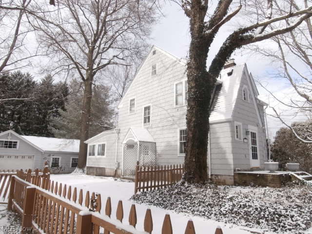 This Copley 3 bedroom, 2.5 bath home on 1.67 shady acres has:
• Fun-living
• Formal-living
• Plenty of storage spaces 
• Very large fenced backyard with swingset
• Separate fenced area along Betula.
• Central Air 
New addition at rear of house has a larger sun room/dining area, hall that takes you to the added gathering room with entertainment center built around the gas fireplace.  Pool table provided!   This room has a mini-bar and bathroom (shower only).  Access off this room to large fenced backyard and to the 2 car garage (plus an additional 2 car space for your outside toys, lawn maintenance tools, and, could even store a small RV or boat, if you have them.)  Two driveways:  one off Schocalog and one off Betula.

Modified older home in front has traditional 3 bedrooms up with full bath, and finished attic.  Living room has fireplace and wood floor; renovated half bath adjacent.  Kitchen has been renovated (stove, refrigerator, dishwasher) and has large pantry.  Kitchen o