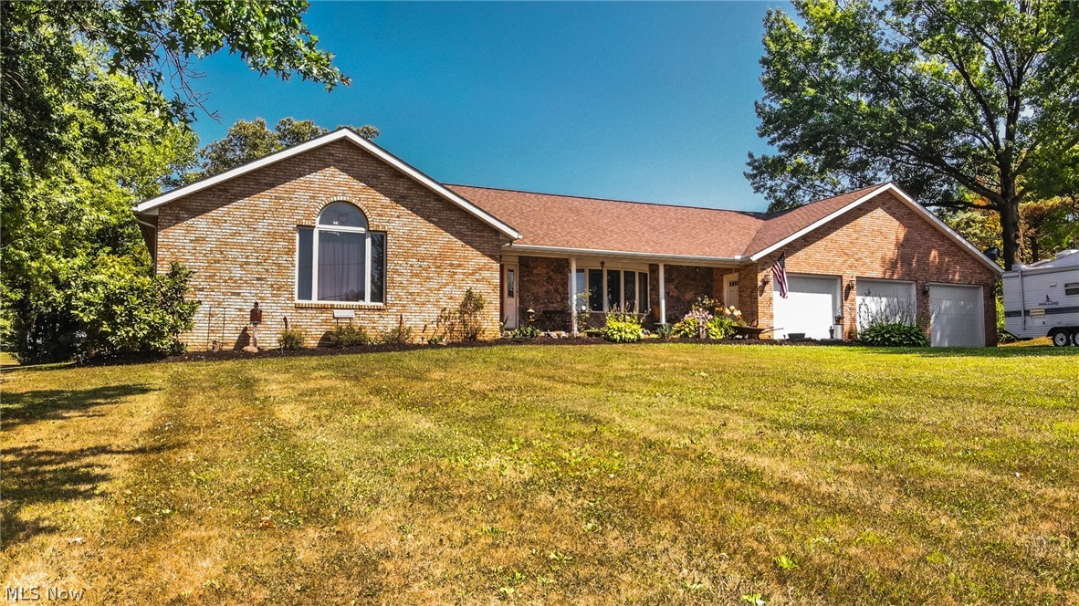 What an opportunity to own a spacious, brick ranch home in the desirable Lake Harmony community. This home gives you plenty of room to entertain  all your family and friends, plus you can utilize all the amenities of this lake community, a private beach, rent a pavilion for the day, or enjoy the lake on your jet ski or boat. This quality custom built home features 4 bedrooms, 4 full bathrooms, over sized 3 car attached garage with a shop or storage area, vaulted ceiling, beautiful stone fireplace, large covered porch, private deck and more. The large master suite includes a cedar walk-in closet, double closet, personal vanity makeup station and full bathroom with a Jacuzzi tub and shower. The main floor also includes 2 additional nice size bedrooms, 2 full bathrooms, main floor laundry, family room with stone fireplace, great room with vaulted ceiling, and a large eat-in kitchen with stainless steel appliances. The lower level would make a perfect in-law suite with a full kitchen, full