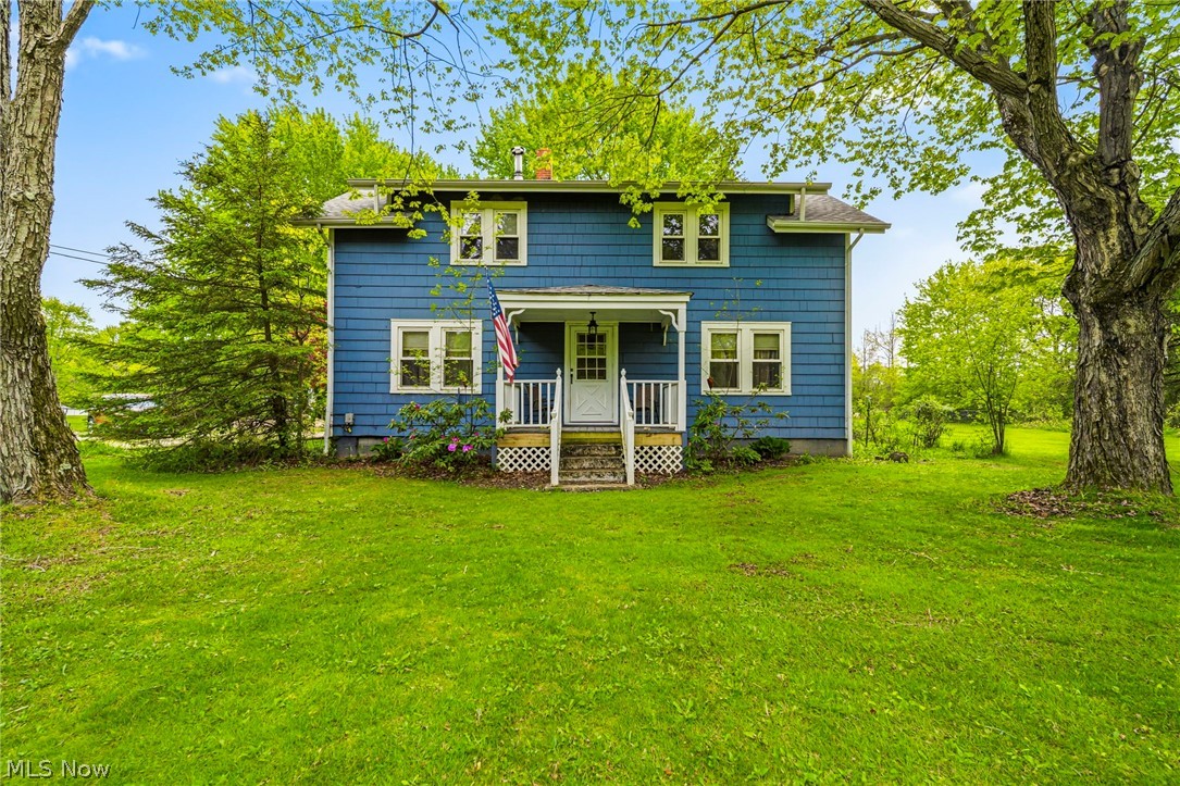 Country living at its finest! Nestled on approximately 4 scenic acres in Ashtabula County, this charming farmhouse-style home offers the perfect blend of privacy, character, and space to spread out. Surrounded by mature trees and peaceful views, this property features spacious living areas, large bedrooms, beautiful natural light, and cozy country charm throughout. Enjoy relaxing mornings on the covered porch, entertaining outdoors, or simply taking in the beauty of the acreage. The property also offers a large driveway, ample outdoor space, and endless possibilities for gardening, recreation, hobbies, or future expansion. Conveniently located while still offering a peaceful rural setting, this unique property is ready for its next owners to make it their own!