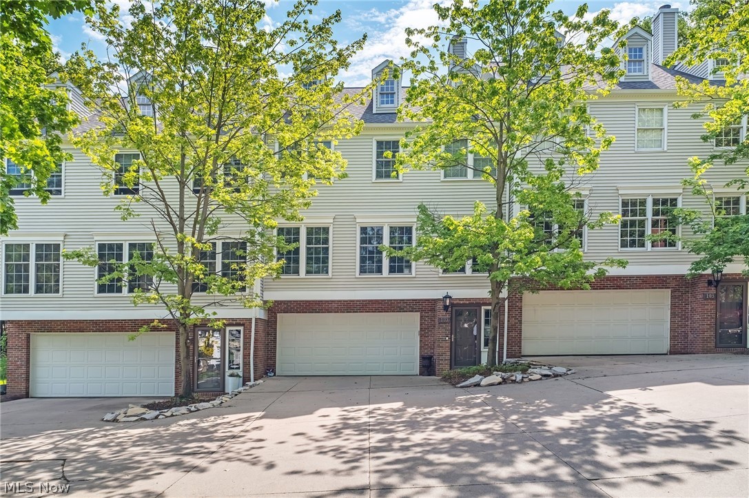 Rarely available 3-bedroom, 2.5-bath three-level townhouse in the heart of Rocky River offering abundant natural light, treetop views, and everyday convenience. The open main level features a spacious great room with built-ins and floor-to-ceiling windows, flowing into a flexible dining area ideal for a home office or additional living space. The updated kitchen includes granite countertops, stainless steel appliances, and direct access to a private patio perfect for outdoor dining or relaxing. Upstairs, the primary suite offers a walk-in closet and private bath, with two additional bedrooms featuring generous closets and a full hall bath. Major updates provide peace of mind, including replacement windows, attic insulation, furnace (2023), central air (2025), new garage door (2025), and newer carpeting upstairs. Prime Rocky River location close to Lake Erie, Elmwood Park, schools, shopping, and dining, with walkable access to area amenities and highly rated Rocky River schools. A rare opportunity in a highly desirable location—hurry, schedule your private showing today and make this home yours before it’s gone!