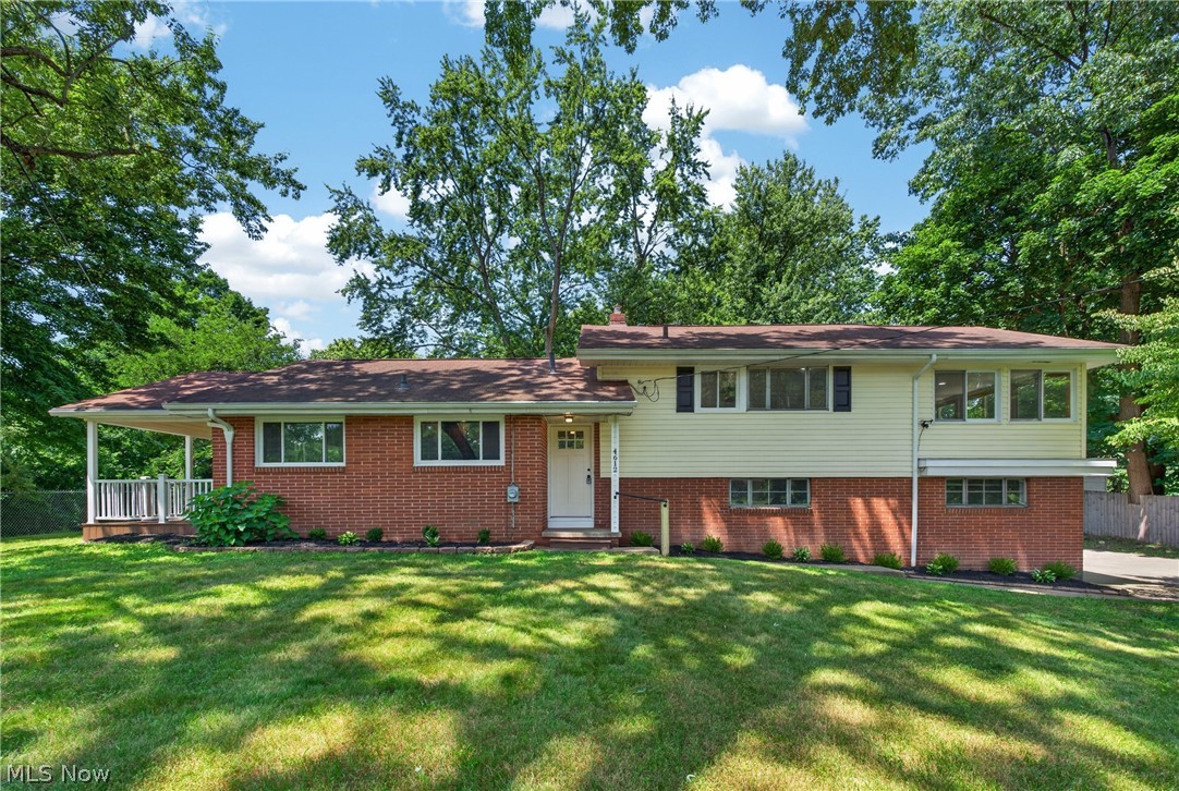 Looking for a turnkey 3 bedroom home in Green Local School District with a spacious lot? Welcome to 4612 Provens Dr. Akron, OH 44319, where modern updates, generous living space, & an outstanding location come together. Offering over 1,800 square feet of finished living area, this renovated split level features 3 bedrooms, 1.5 bathrooms, & stylish finishes throughout. The timelessly remodeled kitchen features custom cabinetry, quartz countertops, SS appliances, & abundant storage. The adjacent dining area flows seamlessly into the bright, inviting living room, where a versatile bonus nook is perfect for a home office, play area, or even your pet's favorite retreat. Just off the living room, step onto the expansive covered deck overlooking the peaceful backyard & front yard, truly making it possible to simultaneously entertain both indoors & outdoors. One of the home's standout features is the private four seasons room located directly off the primary bedroom. Spanning the full length of the home, it offers the perfect place to relax, work from home, enjoy morning coffee, or unwind while taking in peaceful views year round. The finished lower level recreation room adds valuable living space that can easily serve as another family room or flex space. Walkout through the sliding doors to the covered side patio for additional indoor/outdoor living. Situated on an oversized lot with mature trees, the home offers exceptional outdoor space rarely found in the area. Located just minutes from Nimisila Reservoir, you'll enjoy easy access to boating, fishing, walking trails, parks, shopping, restaurants, & everyday conveniences while benefiting from the highly sought after Green LSD. This exceptional home delivers the perfect combination of modern updates, functional living space, & an unbeatable location. *Ask your agent for the property inspection report, upgrades, home info, & well/septic reports provided in MLS supplements.