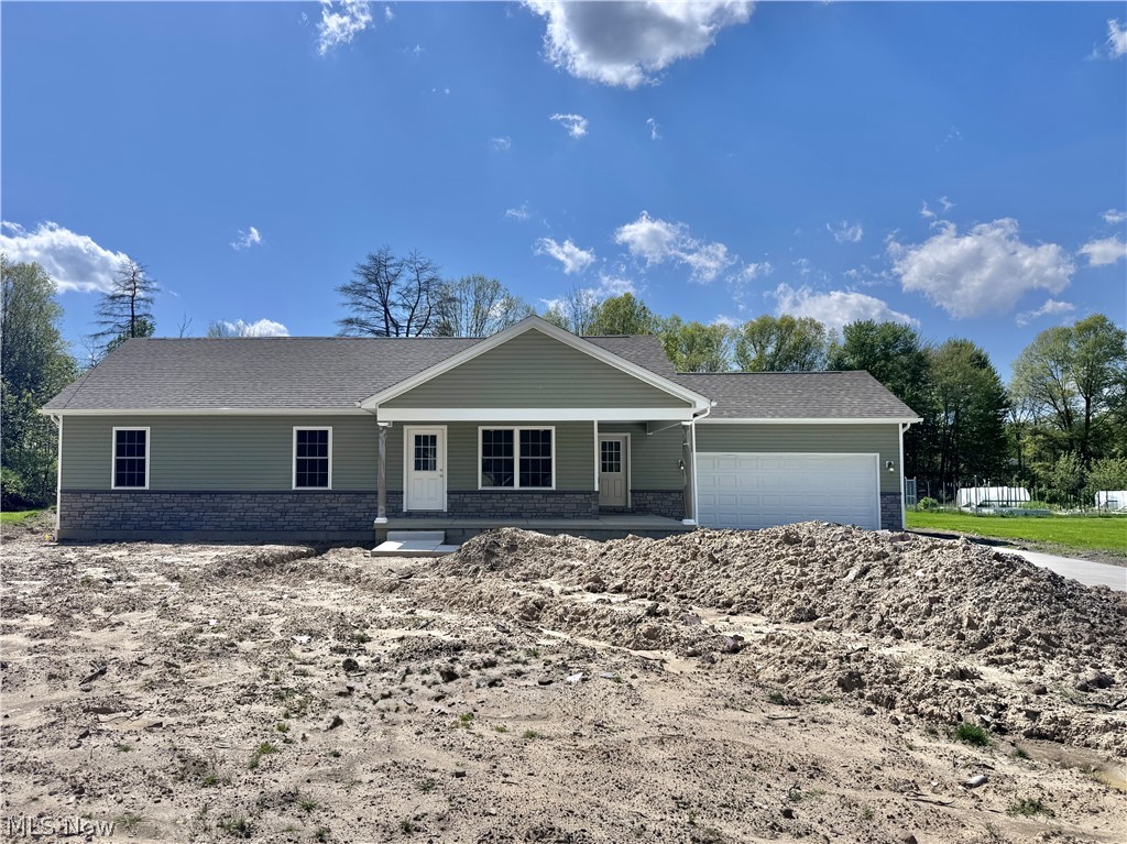 Welcome to this stunning new construction ranch in Austintown, Ohio! This beautifully designed 3-bedroom, 2-bath home offers modern comfort, quality craftsmanship, and effortless one-floor living. Step inside to an open-concept layout featuring a spacious living area filled with natural light, perfect for both relaxing and entertaining. The thoughtfully designed kitchen showcases stylish white cabinetry, sleek countertops, and a functional layout that flows seamlessly into the dining space. The private owner’s suite offers a peaceful retreat with a well-appointed en-suite bath and generous closet space. Two additional bedrooms provide flexibility for guests, a home office, or hobbies, along with a second full bath designed with modern finishes. Enjoy the convenience of first-floor living, energy-efficient construction, and low-maintenance features throughout. The attached 2 car garage and well-sized yard, nearly an acre!The covered front porch and rear concrete patio add even more space and appeal. Full unfinished basement is a blank canvas for whatever you can imagine. Located in Austintown, close to shopping, dining, parks, the library and major routes, this move-in-ready home blends style, comfort, and convenience.
Don’t miss your opportunity to own brand-new construction in Austintown!