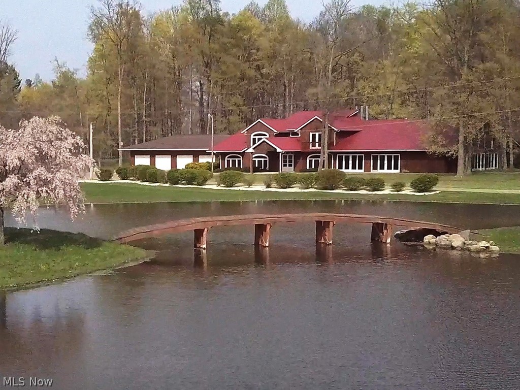 Beautiful 20 acre estate with 5 acre lake and surrounded by high fence! Access to miles of trail for hiking, biking and horseback riding. The recently updated 9000+ square feet home has all the amenities you would want in a property of this caliber. It also has a 60x40 barn for any use you may choose. Perfect for your home, a recreational home or B & B. Can easily be converted to off grid living! Check out the videos!