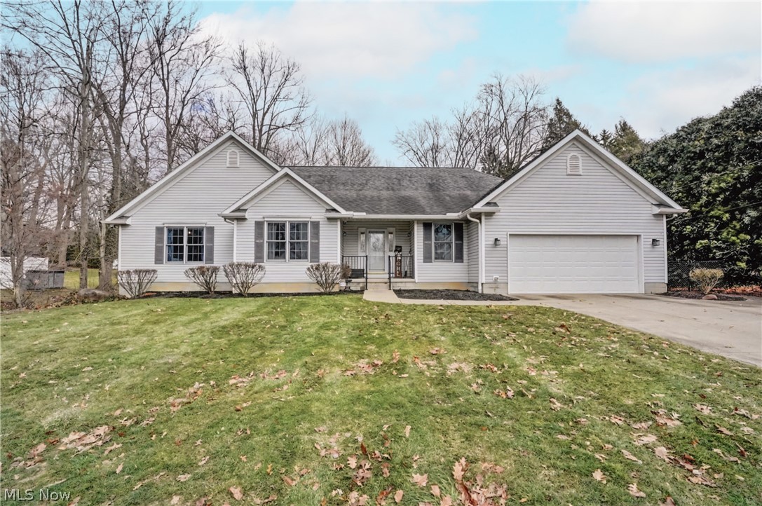 Wonderful Ranch w/3 beds/2 full baths on 1st floor & addl 2 beds/1 full bath on lower level. First floor has Great room w/cathedral ceiling, gas firepl, ceiling fan, lg winds overlooking deck/backyard, w/open floor plan to eat-in, fully applianced kitchen w/cath ceiling & 2 skylights, walk-in pantry, also open to dining room w/chandelier & door to deck. Also sun room overlooking backyard & 1st floor laundry w/utility tub, cupbds & closet w/rod. Primary BR w/trayed ceiling/lights, bay window overlooking backyd, door to deck, & primary bath w/jetted tub, step-in shower, heated floor & walk-in closet w/blt-ins. 2 more beds, 1 w/2 double closets & entry to main bath. Addl living suite in the lower level has large living room, eat-in, fully applianced kitchen, two bedrooms, full bath w/step-in shower, oak vanity & linen closet, & stackable washer/dryer, 2nd elect box and walk-out to it's own patio. All lower level furniture is available to stay. There's an unfinished bonus room in additional to the rest of the unfinished portion of the basement w/ots of storage shelves. Attached 2-car garage with h/c water, drain, elect, & attic. Also included hard wired security system, wring doorbell & thermostat. Updates include 150 amp elect, A/C 2023. Home Warranty.  So much to see - Make an appointment today to see your fantastic new HOME!  *(Note-the back property line extends beyond the chain link fence, to the tree line behind it)