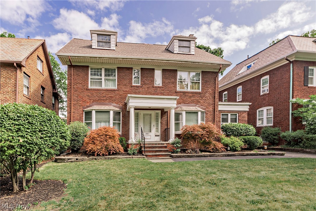 Timeless elegance meets exceptional space in this beautifully cared for 2,950 square foot brick center hall Colonial. Situated on a picturesque tree lined street just minutes from University Circle, world renowned hospitals, universities, museums, and cultural attractions, this home offers the perfect blend of classic charm and modern comfort.Step inside to discover spacious room sizes, hardwood floors throughout ,and abundant natural light. The inviting living room features a classic wood-burning fireplace and a beautiful bay window, creating a warm and welcoming atmosphere. The elegant formal dining room, also enhanced by a bay window, is perfect for hosting holidays. Relax year-round in the cozy den or enjoy the pretty yard in the enclosed porch. With a 2 car garage,    central air conditioning, and a new roof this home has so many architectural details and a great location. Don't miss this rare opportunity to own a gracious Colonial in one of the area's most desirable neighborhoods.