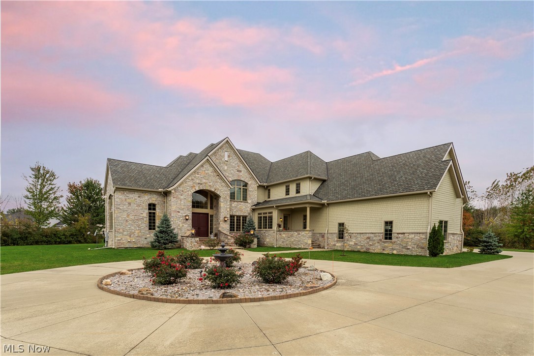 Nearly 10,000 s/f custom home sits on a 3+ acres lot. Designed by The Arcus Group Inc & built by Ronald Puzzitiello Fine Homes. No detail was spared in the construction & the highest quality finishes were used. Pull into the wrought iron gates, approach the stone facade, and into the 4 car garage. Enter and be greeted by the double height foyer, 24x24 Afyon cream marble floors, winding staircase w/wrought iron spindles, crystal chandelier on auto lift system, and an exorbitant amount of natural light flooding in through Pella windows. To the left, find a formal office adorned w/mahogany & to the right, a formal dining room w/marble inlay, chandelier, and 2 tone crown molding. The open floor plan is ideal for entertaining & combines the great room, eat-in kitchen & sitting area w/fireplace. The kitchen features 10 ft ceilings, bi-level center island, travertine back splash & sub zero refrigerator. The 1st floor master suite is spacious & boasts attached travertine bath with double vanity, soaking tub, 6 fixture walk in shower & walk in closet. All 6 bedrooms have private baths & Closet Factory systems. The lower level was thoughtfully designed w/full eat-in kitchen, family room, wet bar, egress windows, theater & audio/media room. Enjoy the backyard on the covered porch/patio or escape to the indoor pool house that allows swimming no matter the weather. Heated pool & 8 person hot tub. Schedule your private showing today!