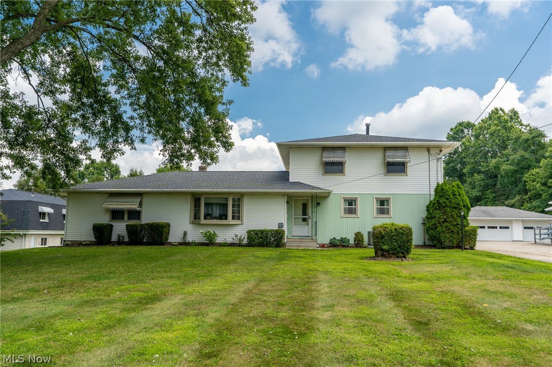 Wonderfully private and successfully rented for over 15 years.   Family gem. This home is currently designed as a two unit.   Top floor is 875 3 bed 1 bath  3rd bedroom used as laundry room with washer and dryer. Main floor unit  is 1175 2 bed 1 bath with a utility room and washer and dryer.   Basement and Garages, in addition to,  a walk out balcony on the above unit, and a sun room on the main level unit.   Both currently occupied and renting month to month at $800 each.