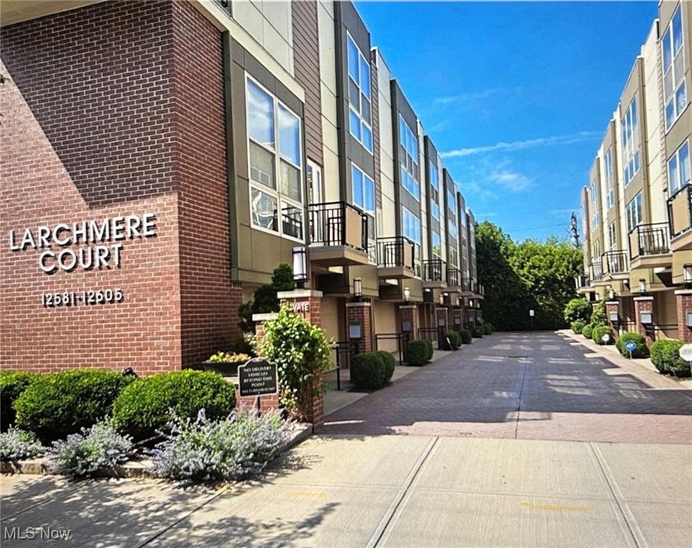 Beautifully updated 2-bed, 2.5-bath townhouse located in the heart of the vibrant Larchmere Art District, minutes from University Circle, Cleveland’s cultural hub. Enjoy an unbeatable location steps from Shaker Square, rapid transit access to downtown or the airport, and top institutions like Cleveland Clinic, University Hospitals, and Case Western Reserve University. This rare gem with original long term owner features a private courtyard and rooftop Trex deck with sweeping views of downtown—perfect for peaceful mornings/evening gatherings. Inside, you'll find nearly every detail thoughtfully updated. Entry level offers an attached 1-car garage with walk-in storage closet and bonus room with LVT flooring, heating/cooling, and natural light—ideal as a 3rd bedroom, office, or fitness space. Up the newly stained wood staircase, the second floor features a light-filled open layout with high ceilings, updated fixtures, and beautiful hardwood floors. The spacious great room boasts a gas fireplace, floor to ceiling windows, balcony access, and seamless flow into the updated kitchen with granite counters, solid wood cabinetry, peninsula seating, gas cooktop, and all appliances stay — including new '23 refrigerator. A stylish updated half bath and ample storage round out this level. Upstairs, brand new carpet leads to two generously sized bedrooms, each with floor to ceiling windows and their own full bathroom. Primary suite offers a walk-in closet, and stunning bathroom with a '24 marble shower floor, marble vanity, tile surround, and linen closet. Convenient hall laundry closet with stackable washer/dryer. Don’t miss the private rooftop deck, recently stained/sealed, a quiet escape with stunning skyline views. Additional Updates: Low emissivity windows to keep out the heat, Brand new AC June '25 & furnace (end of '24), Hot water tank & Interior paint ('18). Rare opportunity to own a move-in-ready townhome in one of Cleveland’s most artistic and accessible neighborhoods.