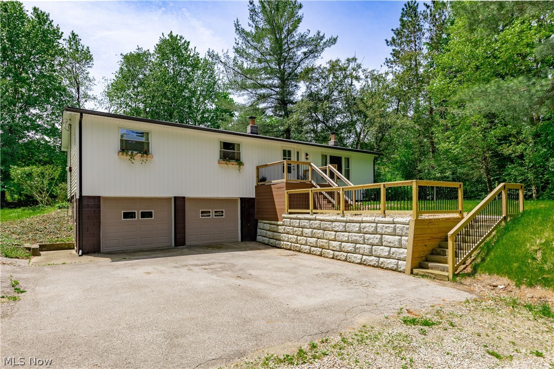 Tucked away on a private, wooded acre-and-a-half lot on a quiet street in Newbury Township, this beautifully remodeled 3-bedroom, 2-full-bath ranch offers over 1,900 square feet of move-in ready living space in the highly rated West Geauga School District. 

Thoughtfully updated from top to bottom, the home features a brand-new eat-in kitchen with granite countertops, all-new cabinetry with soft close, and brand new appliances perfect for everyday living and entertaining alike. Both bathrooms have been tastefully updated, including the primary bath. New flooring flows throughout and beautiful wood doors and trim accent the modern feel of the home, complemented by replacement windows bringing in plenty of natural light. 

Major mechanicals have all been updated, including a newer furnace, hot water tank, and roof providing true peace of mind backed by a 2 year home warranty. The finished basement adds valuable additional living space and connects seamlessly to a mudroom and 2-car attached garage. 

Whether you're unwinding on your private wooded retreat or exploring all that the Geauga County has to offer, this turn-key ranch checks every box. A rare find at this price schedule your private showing today!