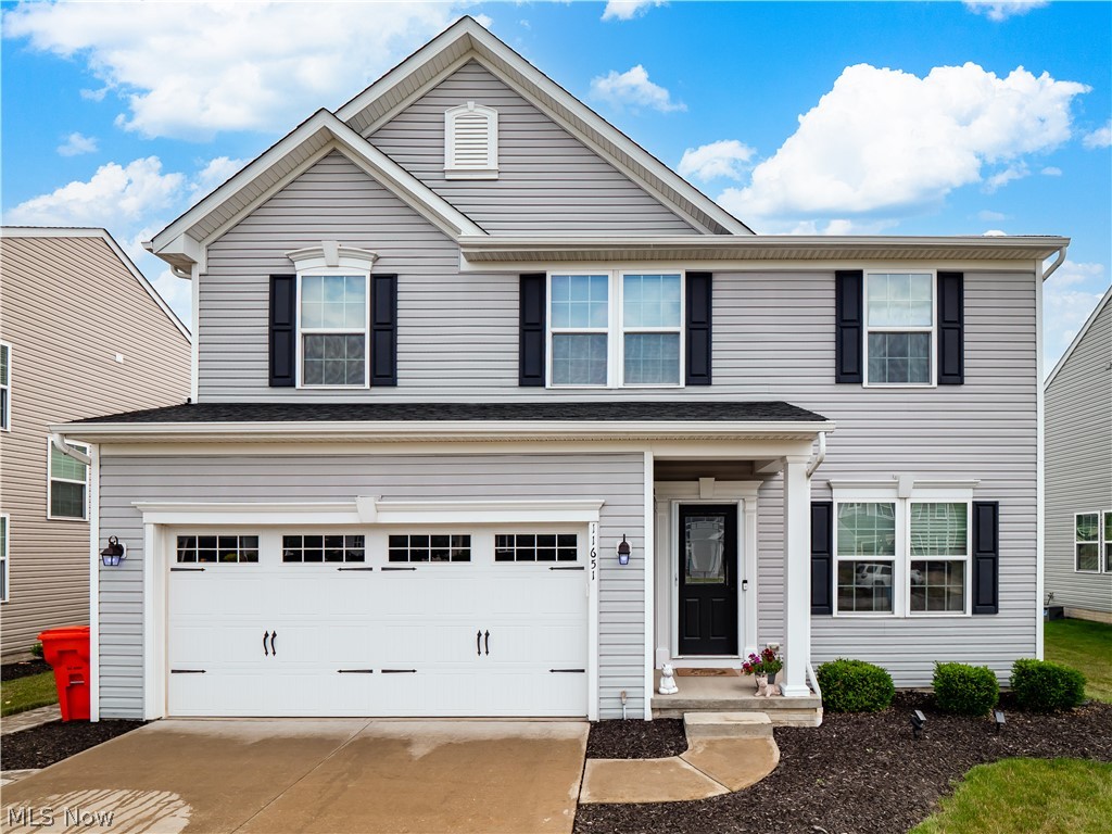 Look no further—welcome home! This beautiful 4-bedroom, 2 full and 2 half bath Colonial offers charming curb appeal and a fully fenced backyard designed for both relaxation and entertaining.

Step inside to gorgeous hardwood floors and soaring ceilings that create a warm and inviting first impression. A versatile front room provides the perfect space for a home office, den, or playroom and flows into the formal dining room. The spacious living room features a cozy gas fireplace and opens seamlessly to the chef's kitchen, where you'll find granite countertops, abundant counter space, and a layout that's ideal for everyday living as well as hosting family and friends. A convenient mudroom and half bath complete the main level.

Upstairs, the spacious primary suite serves as a private retreat with a walk-in closet, ceiling fan, plush carpeting, and an en suite bath featuring a double vanity and walk-in shower. Three additional bedrooms, each with carpeting and ceiling fans, provide comfortable accommodations for family or guests. A second full bathroom and the convenience of second-floor laundry complete the upper level.

The partially finished basement offers additional living and entertaining space while still providing ample storage.

Step outside to your backyard oasis featuring a large patio, pergola, and a fully fenced privacy yard—perfect for outdoor gatherings, play, or simply unwinding.

Don't miss your opportunity to make this exceptional home yours—schedule your private showing today!