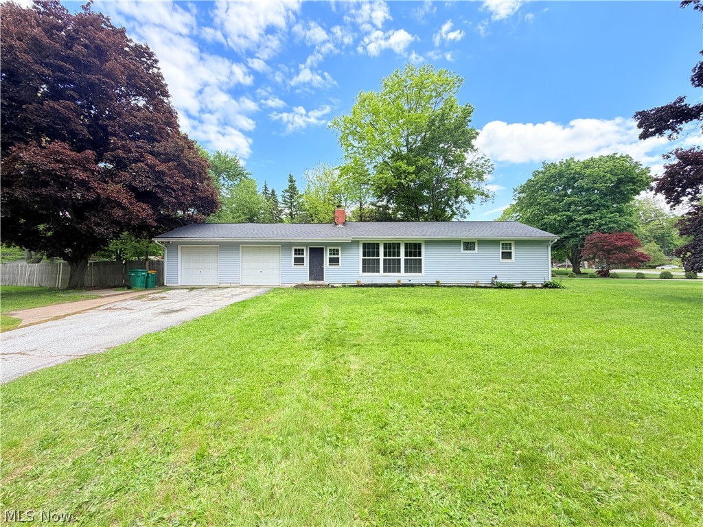 Welcome home to this large ranch on a quiet, no outlet street in the heart of desirable Mentor! This home has an expansive corner lot with a fenced in area that contains a basketball court. Loads of potential for this yard to be your new private oasis. Inside you'll find two separate living areas, formal dining, galley kitchen, and 3 bedrooms. Downstairs is a large finished basement with utilities, laundry, and a full bath. All appliances are included. There are two attached garage bays. The interior does need some cosmetic improvements, but you cannot beat this quiet location close to all that Mentor has to offer. Close to shopping, restaurants, and highway access, but set on a dead-end low-traffic street. Great school system. Newer roof. Imagine entertaining in the newer back vaulted living room addition, or in the fenced in backyard while playing a game of hoops on the basketball court. This home is vacant and ready to show. Schedule your showing today.