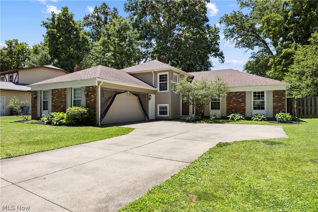Welcome home to 5336 Birch St. in North Ridgeville! This beautifully updated 4-bedroom, 2.5-bath split-level home is truly as turnkey as they come and sits on a nearly 1/3-acre private lot. Most of your major expensive updates have already been completed for you, including newer vinyl windows, a new roof, gutters with gutter guards, new siding, a new heat pump and even a new washing machine. Inside, you'll love the refreshed kitchen featuring a stylish new coffee bar, while the shared full bathroom boasts a brand-new tub/shower and fixtures. The spacious primary suite offers an updated private bath complete with a custom tile shower, new flooring, vanity and toilet. The lower-level family room provides the perfect gathering space with a cozy wood-burning fireplace and classic brick mantle. Step outside to enjoy the large rear deck overlooking the fully fenced backyard, complete with a newer fire pit featuring a built-in vent system designed to reduce smoky odors. Conveniently located near major highways, shopping, dining, and everyday amenities, this move-in-ready home combines comfort, style, and peace of mind with updates throughout. ALL APPLIANCES STAY SO ALL YOU HAVE TO DO IS MOVE IN!!!
