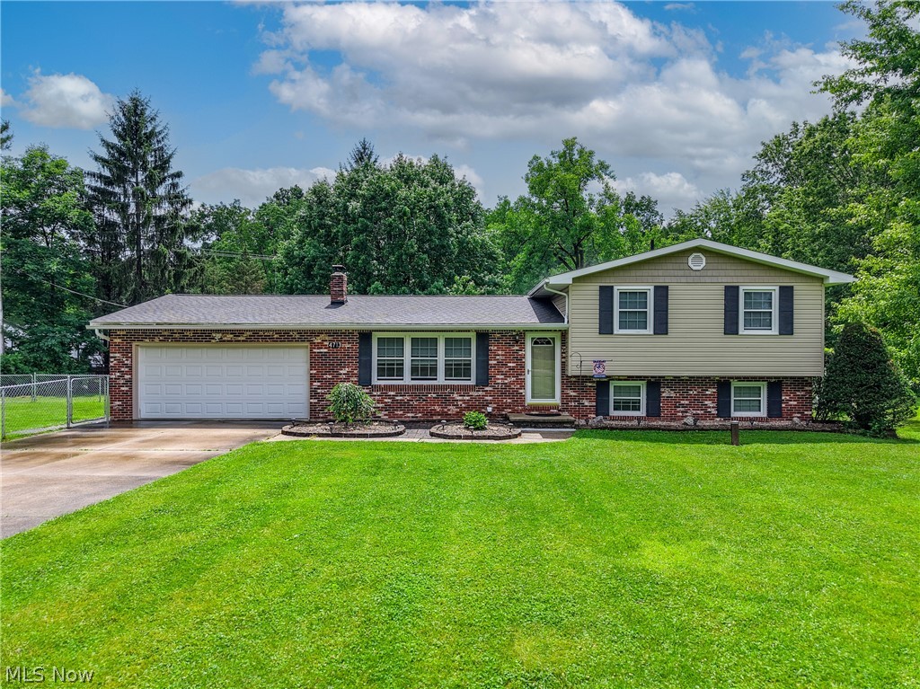Was it you who just made a wish for an incredible 4 bedroom home on over an acre in Brimfield?  Welcome to Sherman Rd, where wishes come true!  An absolutely gorgeous rural setting, w/ 1.25 acres to call your own.  No better way to enjoy it, than the amazing new 24x24 back deck!  On summer's hottest days, you get to stay cool in the shade of the gazebo.  Cedar frame, metal roof & solar lights to top it off!  This deck gives access to the sunroom & wraps all the way around to the garage!  The side yard has recently been fenced in as a dog run, there is a big fire pit at the back & huge shed w/ metal roof.  The foyer offers a large coat closet & opens to the center of the home.  A wall of front facing windows keeps the formal living room nice & bright.  Up next is the open dining & kitchen area.  A great spot to stay part of the conversation, while you do the cooking.  Sliders & a window connecting to the sunroom too!  Plentiful cabinets, peninsula w/ counter height seating, metal accent backsplash & all appliances included.  If you thought the deck was great, you'll love the sunroom!  A wood flanked wall, beamed ceiling & windows all around!  This room is heated, so you can appreciate it all year round.  On the 2nd level, you'll find 3 bedrooms, including the master w/ private access to the bathroom.  Down to the lower level is an amazing family room featuring a rustic wood wall & wood burning fireplace.  Around the corner is the 4th bedroom & 2nd full bathroom!  There's still one more level to go!  The wide open rec room has a wall of closets that hide the laundry, water softener, sump pump & water heater.  A new wood burner will keep you cozy & warm in the winter!  Utilize the rest of the space to play pool, convert to a movie room or just great storage.  More great updates to add to the list; brand new living room floor, some fresh paint through the home, new septic in 2021, updated electric 2021, roof 2020, siding/gutters/windows & A/C 2016.  This is a MUST SEE!