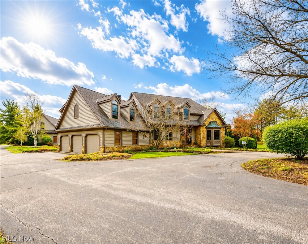 Welcome to this extraordinary estate offering over 5,000 square feet of thoughtfully designed living space, perfectly situated on more than 6 private acres with scenic views and two ponds.

This impressive home features 5 spacious bedrooms and 4 full bathrooms, designed for both comfort and functionality. Step inside to experience soaring ceilings, an open-concept floor plan private first-floor office and abundant natural light throughout. Dual staircases lead to the upper level, adding both elegance and convenience.

The main level includes a desirable first-floor laundry room and expansive living and entertaining spaces ideal for modern living. The finished lower level is a standout feature, complete with a private in-law suite including a full kitchen, separate staircase access, and a dedicated workout room perfect for multigenerational living or guest accommodations.

The estate's beautifully appointed carriage house offers approximately 2,000 square feet of versatile space, blending charm, privacy, and modern comfort. This thoughtfully designed structure provides endless possibilities.

A large versatile barn with heating and cooling, plus a loft above, provides endless possibilities's whether for a workshop, studio, storage, golf simulator also featuring its own 3-car garage.

Surrounded by nature, the property's two ponds and expansive acreage create a serene, private setting while still offering ample space for outdoor activities and entertaining.

This one-of-a-kind property combines luxury, space, and flexibility truly a rare opportunity.