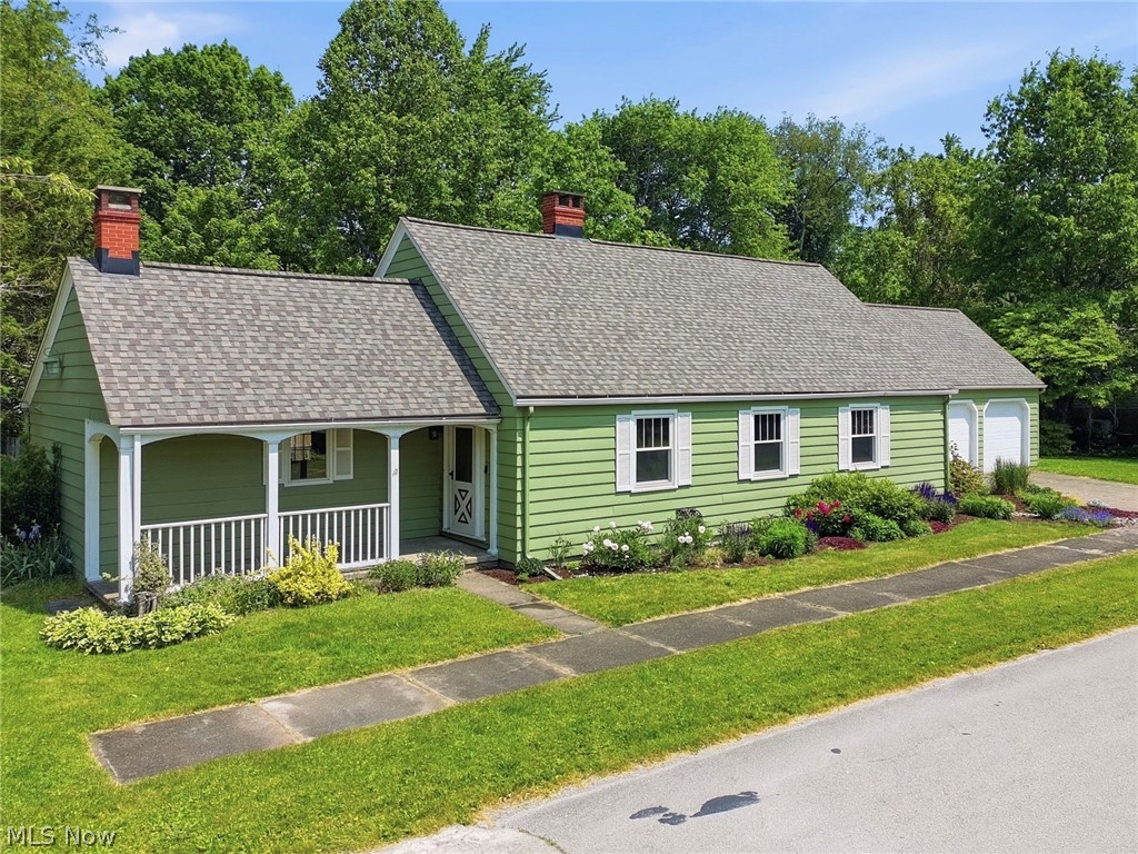 Meet 614 Whitney Road - This charming cape cod offers great curb appeal, a spacious interior, and an attached 3-car garage. You are welcomed into a spacious living room with classic details like crown molding and fireplace with mantle. The eat-in kitchen is grand with a vaulted ceiling, kitchen island, fireplace, garden window, dining space and access to the private back yard. Enjoy the convenience of one-floor living with 2 main-floor bedrooms, an updated full bathroom, office, and laundry - all on the first floor. Upstairs you will find the 3rd bedroom, 2nd full bathroom and a large unfinished storage room. The basement offers even more space for your storage needs.  The front yard is beautifully landscaped and out back there is a private yard with fenced in area and wood deck. The massive attached 3-car garage is a standout feature, offering valuable space for vehicles and much more. The side yard offers an extra spot with the potential for boat or RV parking. This home is located less than a half mile from Lake Erie and just 1.5 miles from Conneaut's lakefront park and beach. Updates in the past 5 years include a bathroom renovation, new roof, exterior paint, and front landscaping, Schedule your private showing today!
