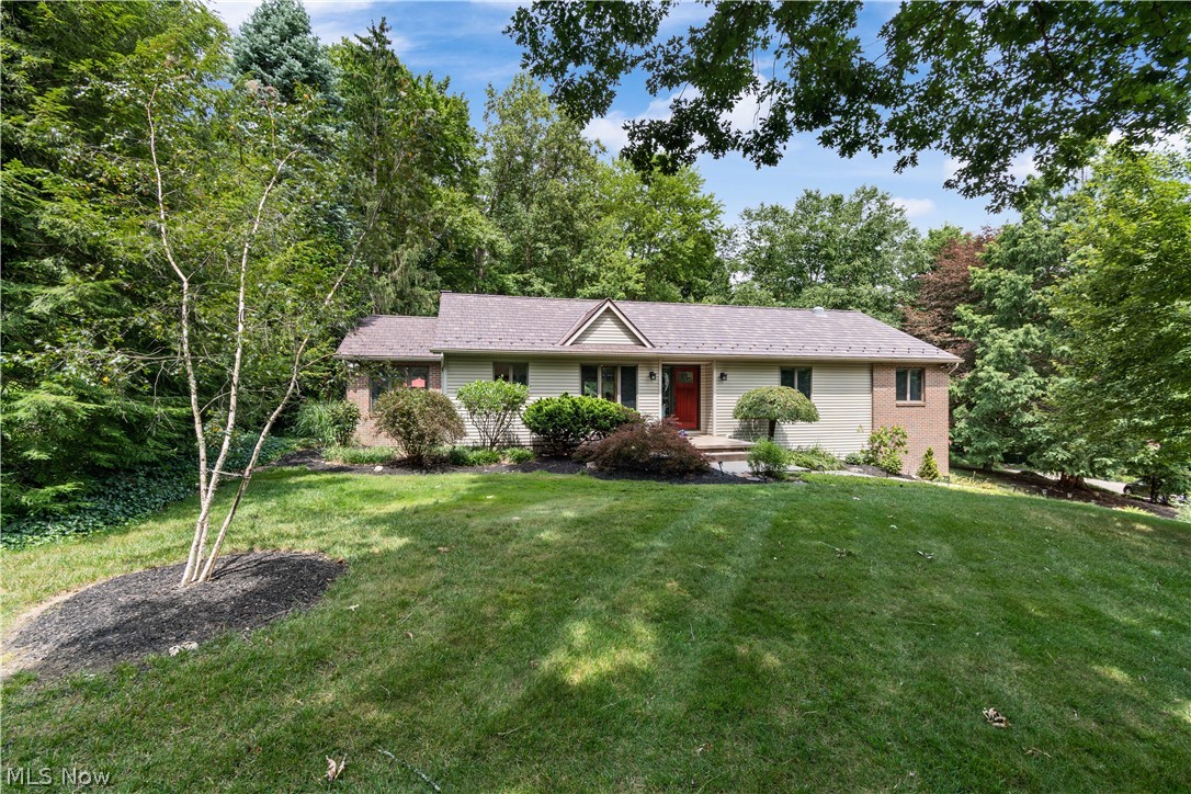Welcome home to 2420 Wimpole Street.  Tucked back in a quiet corner of Wooster this home has been loved by the current owner for almost 20 years.  No detail of this home has gone unnoticed from the quality of the updates to the decor to the lovely yard.  With a great flow, the main level of this ranch home features a spacious living room with walls of windows, gas fireplace with tile mantel, hardwood floors, and a vaulted ceiling.  Open to the living room is a spacious dining room with easy access to the updated kitchen.  The kitchen counters were just replaced, and the cupboards painted to give this spacious kitchen a lovely update.  There is a great office space off the kitchen with easy access to the parklike back yard.  Down the hall you will find the owner’s suite with en suite full bathroom, spacious closet, and private deck.  Two more bedrooms and an updated full bathroom complete the first floor.  In the walkout lower level you will find a fourth bedroom, full bathroom, family