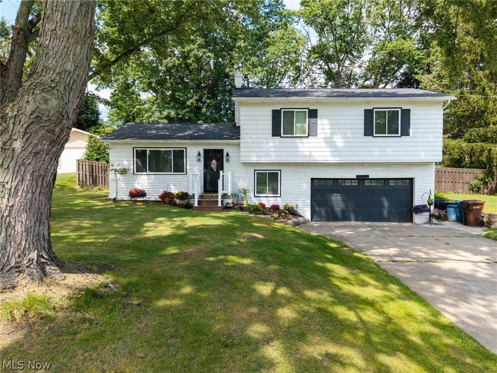 Completely renovated and truly move-in ready, this Springfield Township split-level offers the perfect blend of modern updates, functional living space, and outdoor enjoyment. Situated on a fully fenced 0.44-acre lot, this home has been extensively updated over the past five years with a new roof, windows, furnace, central A/C, hot water tank, and water softener.
The bright, open main level features recessed lighting and luxury vinyl plank flooring that seamlessly connects the living and dining areas. The stylish kitchen is designed to impress with quartz countertops, a subway tile backsplash, soft-close Shaker cabinetry, stainless steel appliances, and a spacious center island with pendant lighting and breakfast bar seating. A sliding glass door leads to a covered pavilion with a TV setup, creating the ideal space for outdoor entertaining.
Upstairs, you'll find four generously sized bedrooms and two beautifully remodeled full bathrooms. The private primary suite includes an updated en-suite bath featuring a walk-in shower and Bluetooth exhaust fan. The remaining bedrooms share a spacious full bath complete with a double vanity, tub/shower combination, and convenient linen storage.
Just off the heated two-car garage, a practical mudroom and laundry area provide everyday convenience, along with an additional full bathroom. The finished lower level expands the home's living space with heated floors, a second full kitchen, a large recreation room, and a built-in butcher block bar—perfect for entertaining, game days, or movie nights.
Outside, enjoy your own backyard retreat with a covered patio, fire pit area, and plenty of fenced green space for pets, play, or gardening. Conveniently located near shopping, dining, schools, and major highways, this home offers the updates, space, and location today's buyers are looking for. Schedule your private showing today!