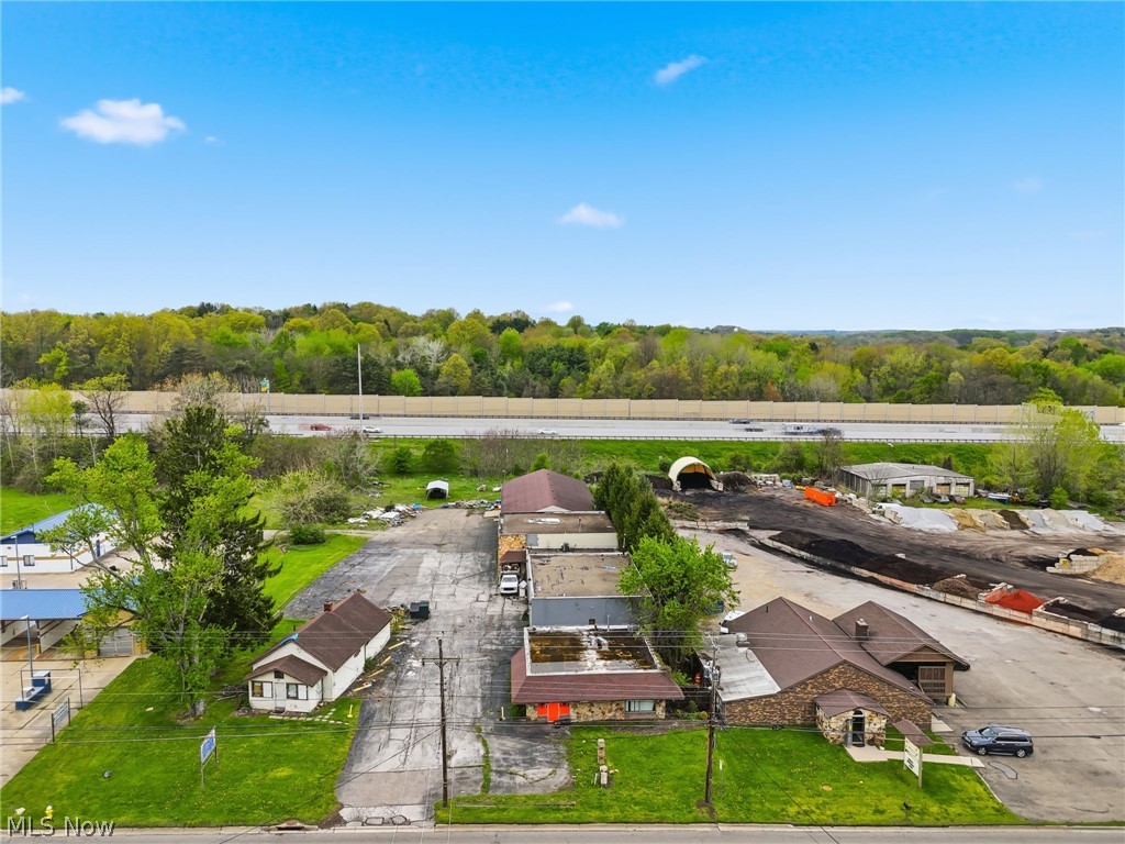 Prime mixed-use opportunity with unmatched visibility along Interstate 77 and South Arlington Road! This multi-address property (2468–2480 S Arlington Rd) spread across 3.7 acres, features a dynamic combination of a bar, restaurant, retail storefront, and multiple large buildings offering exceptional flexibility and income potential. Positioned directly against I-77, this property delivers incredible exposure to thousands of drivers daily, making it ideal for businesses that thrive on visibility and signage. The strong frontage along South Arlington combined with freeway visibility creates a rare marketing advantage that is hard to replicate. The existing mix of commercial uses provides immediate income potential, while the additional large buildings open the door for expansion, redevelopment, or new business concepts. Whether you’re an investor looking for multiple income streams or an owner-operator ready to establish a flagship location, the opportunities here are endless. With ample space, multiple access points, and a layout well-suited for multi-tenant occupancy, this property is positioned for both current cash flow and long-term upside.
High traffic. High visibility. High potential.