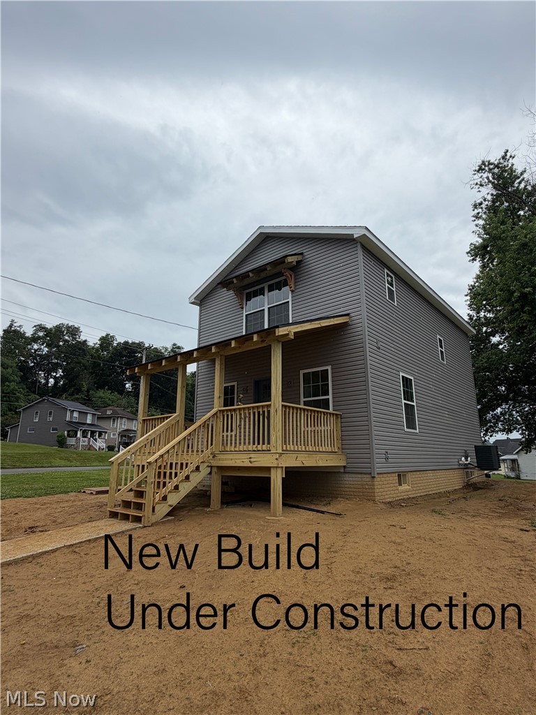 Brand-new construction is coming soon to Zanesville! Scheduled for completion in approximately eight weeks, this thoughtfully designed 3-bedroom, 2.5-bath home combines modern construction, energy-conscious features, and a functional floor plan built for today's lifestyle. The main living areas are designed for comfortable everyday living, while the upper level offers three bedrooms along with a conveniently located laundry area, eliminating the need to carry laundry up and down stairs. Whether you're starting your day or winding down, the layout is designed with practicality in mind. Built with quality from the ground up, the home features 2x6 exterior wall construction for improved insulation and energy efficiency. The full basement includes poured concrete walls, a sump pump, and a passive radon mitigation system already installed, providing a solid foundation and valuable peace of mind. The basement also offers excellent storage space or the potential for future finishing to fit your needs. Outside, enjoy the welcoming covered front porch or relax on the rear deck overlooking the backyard. New sidewalks provide easy access to both the front entrance and the rear concrete parking pad, offering convenient off-street parking from the alley, while additional on-street parking is also available. With brand-new mechanical systems, modern construction techniques, and low-maintenance living, this home offers the opportunity to enjoy the benefits of new construction without the uncertainties that often come with older homes. Conveniently located in Zanesville and nearing completion, now is the perfect time to secure this home before the finishing touches are complete.