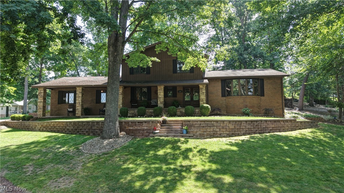 Gorgeous Home! A MUST SEE!!  Quality throughout on this 4 Bedroom, 2.5 Bath home. Schrock cabinets in kitchen and baths, 2 stone fireplaces. Pella windows, the living features a wet bar and walks out to almost 1500 Sq. Ft. of outdoor space, ideal for entertaining! First floor laundry room, partially finished lower level. Spacious 2 car garage with nature stone flooring. In 2025 the entire house was painted and bathroom was updated. Newer spouting, siding and garage door. Beautiful lawn, landscaping and deck area. Country living close to town!  Call today for a personal showing!