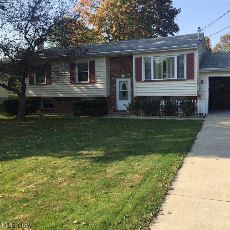 Great starter home for young family. This bi-level is move-in ready. Newer carpeting, new floor in bath, newly painted cabinetry in kitchen w/adjoining eating area overlooking attached, covered & screened sun room. Gas fireplace in family room on lower level plus extra office/den. Home Warranty included.