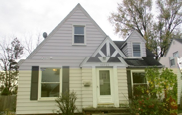 Cute Cape situated near Kamm's Corner.  Great Starter Home!  This spacious home boasts over 1016 sq. ft.  Featuring 3 bedrooms; full bath.  Hardwood floors throughout.  Kitchen provides sufficient cabinetry and counter space with eat in area.  Living room has decorative fireplace with built ins.  Full basement for extra storage.  Your future of owning your own home is just a few steps away.  Close to many anemities Cleveland has to offer.  Add your decorating ideas and make this your home.  Schedule your showing Today!!