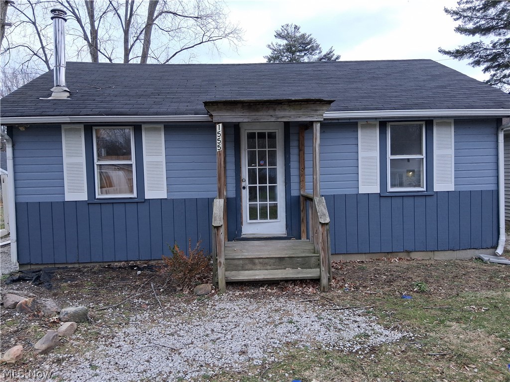 Tucked away in a peaceful setting, this charming 588 square-foot home at 1555 Glenview Ave in Madison offers cozy comfort with rustic character throughout. Lake Erie public access. Featuring 1 bedroom and 1 bathroom, the home showcases a spacious remodeled great room and kitchen with warm knotty wood paneling and soaring vaulted ceilings that create an open, inviting atmosphere. NEW LPV floors. Stainless steel chimney pipe installed through roof for wood burner connection. A versatile laundry room provides additional flex space and could easily function as a second bedroom, office or guest area. Thoughtfully updated while maintaining its cabin-like charming, this property is perfect as a full-time residence, weekend retreat, or investment property.