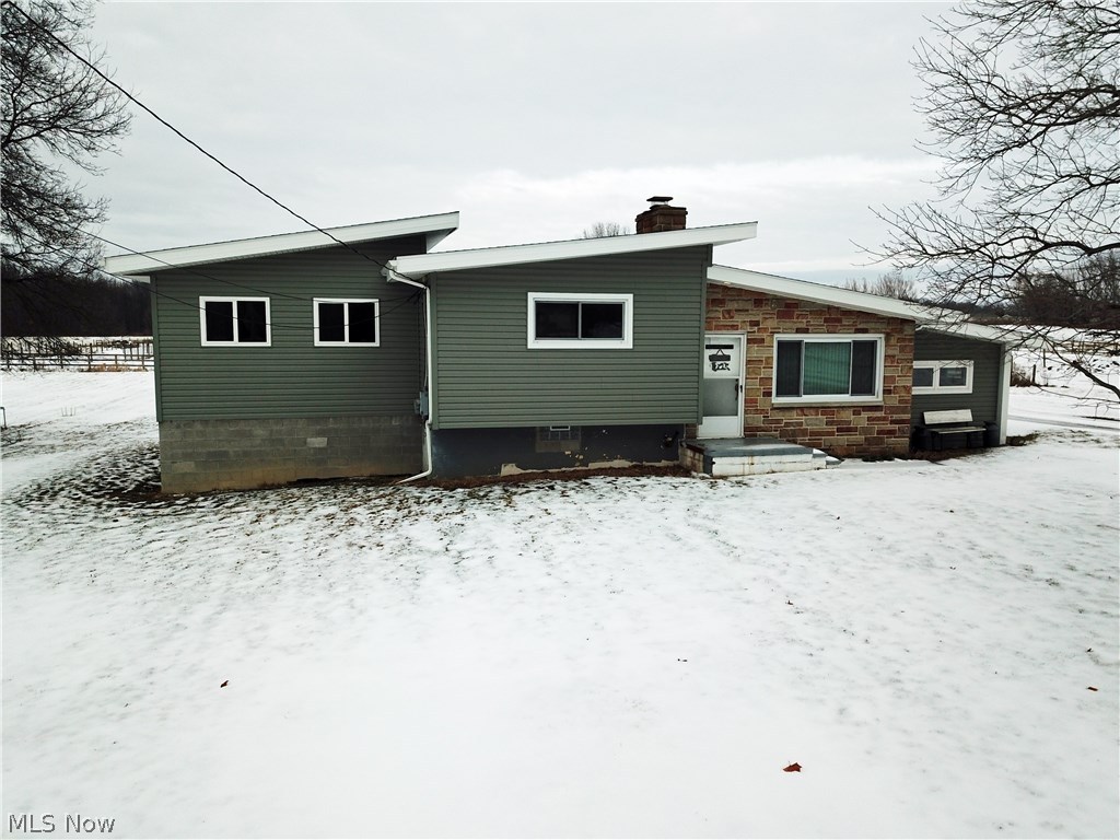 Once of a kind opportunity to own your dream! 15 acre turn-key Equestrian Farm located 10 minutes from West Branch rider trails!  This one has it all and a new master bedroom addition with master bathroom and walk-in closet!  You won't be parking anything outside with garage space for 6-8 cars! This property is set up with a 6 stall 48x48 barn with tack and feed rooms, concrete floors, automatic waterers and turn outs from the stalls.  Eight beautiful wood fenced pastures, lighted indoor 60x120 riding arena (built in 2010), outdoor sand based riding arena, heavy use limestone pad and parking.  Wooded back acreage to cut your own firewood with deer and wild turkey.  Home has a cozy sunken family room and a living room with hardwood floors and a beautiful stone fireplace with a wood burning insert. Whether you want to run a successful boarding business or to give riding lessons this one is for you!  Call today to schedule your showing!  This won't last long!