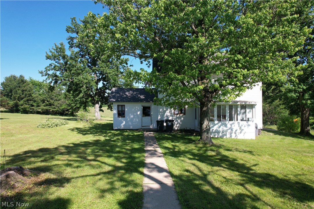 Tucked into the rolling countryside of Diamond, Ohio, this charming 10-acre farm blends space, character, and opportunity. The classic two-story farmhouse offers 3 bedrooms, 1.5 baths, and timeless charm—highlighted by a beautiful two-sided fireplace that opens between the living and dining rooms, plus a bright sunroom perfect for morning coffee and country views.
Outside, a large barn provides flexibility for livestock, storage, or a workshop, and a chicken coop stands ready for your flock. With 10 acres to garden, graze, build, or simply spread out, this property is the perfect canvas for a hobby farm, homestead, or quiet country retreat.
Schedule your private showing today!